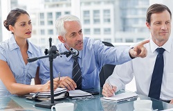 A business mentor helping the team at the financial planning
